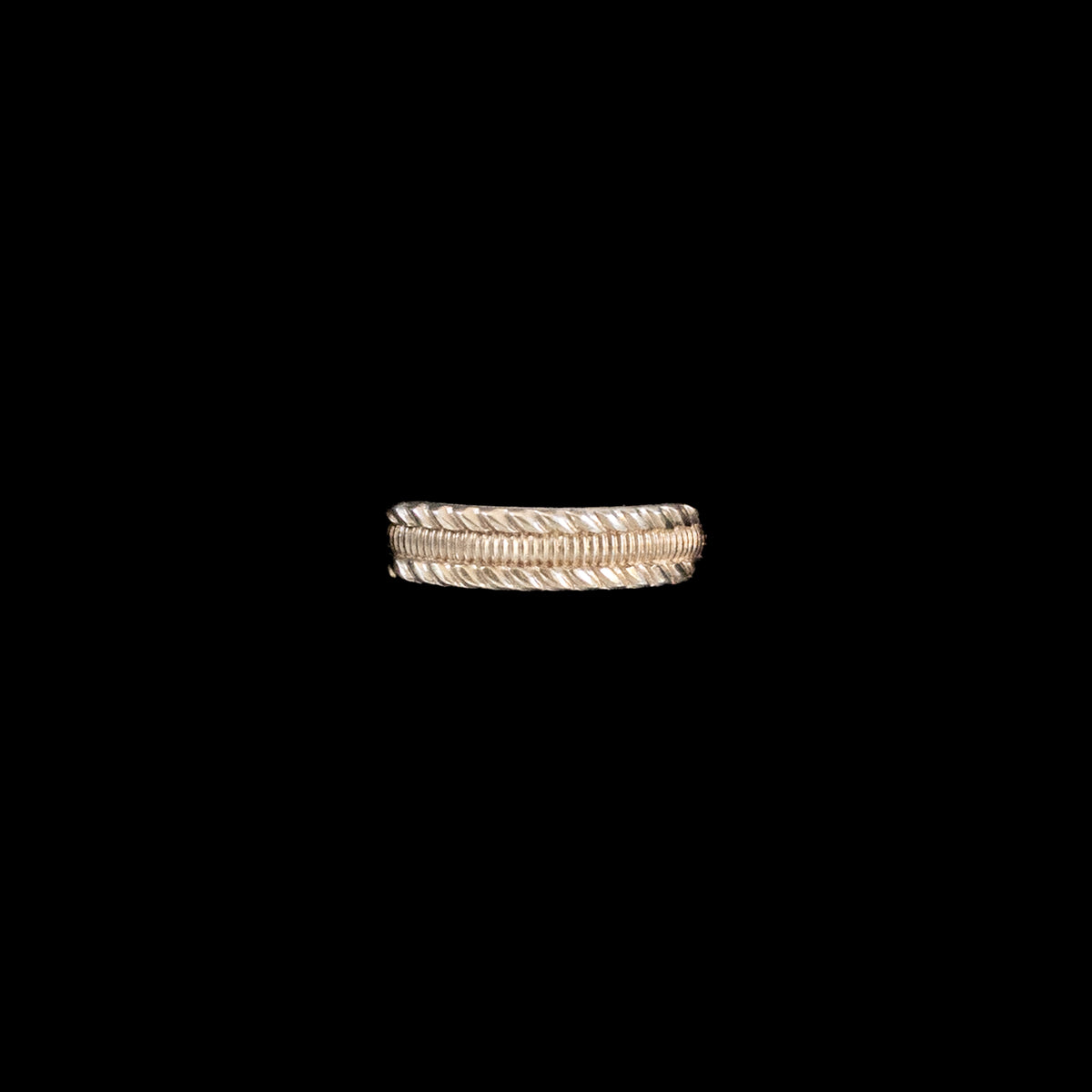 A textured sterling silver band