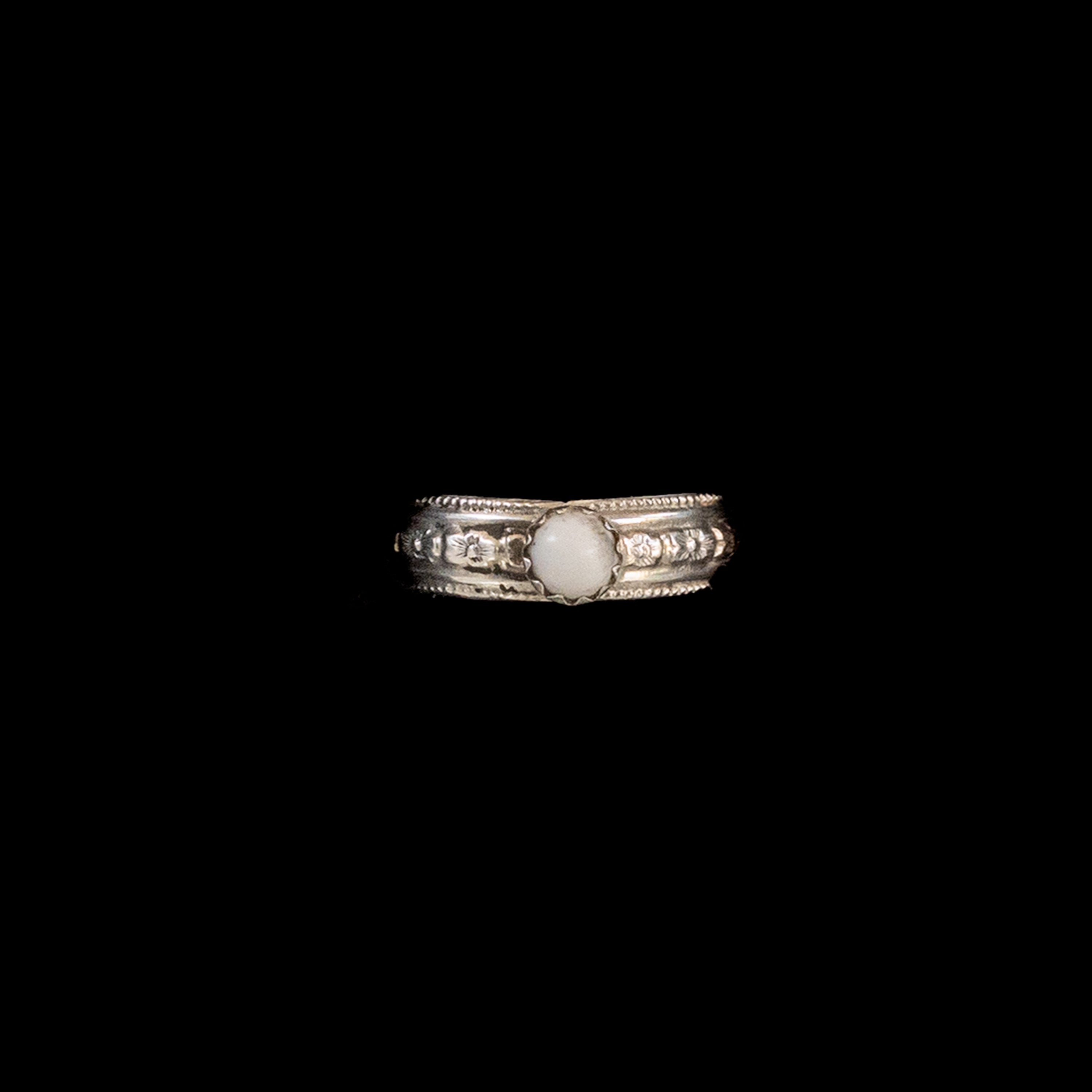 White Buffalo Stone set in Patterned Sterling Silver Ring