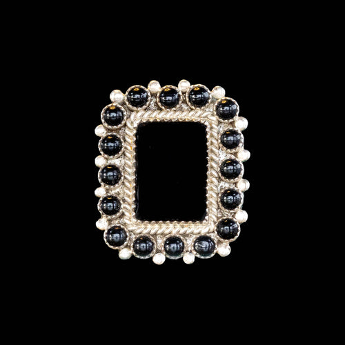 Square framed  onyx with black and silver beads  on a black background