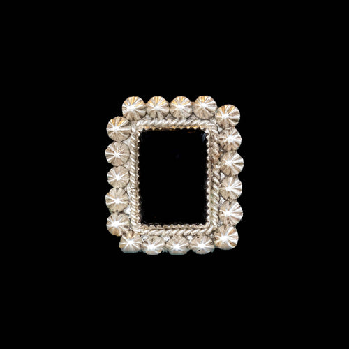 Decorative silver frame of black onyx ring on a black background