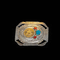 Decorative belt buckle with gold, silver, red, and blue stones on a black background