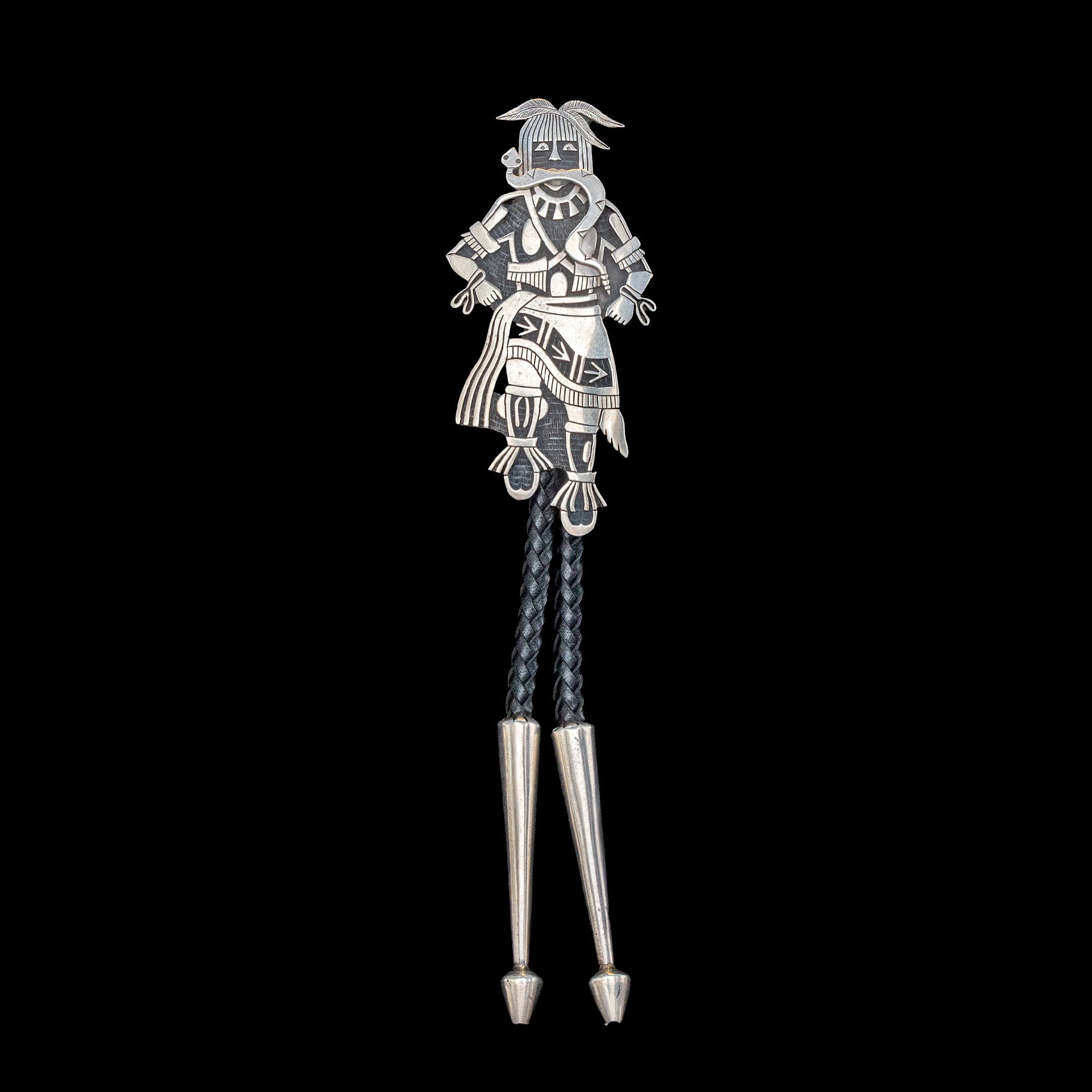 Silver bolo tie with Hopi design on a black background