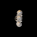 Silver floral ring on a black background