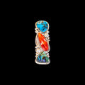 Ring with turquoise, shell, and coral on a black background