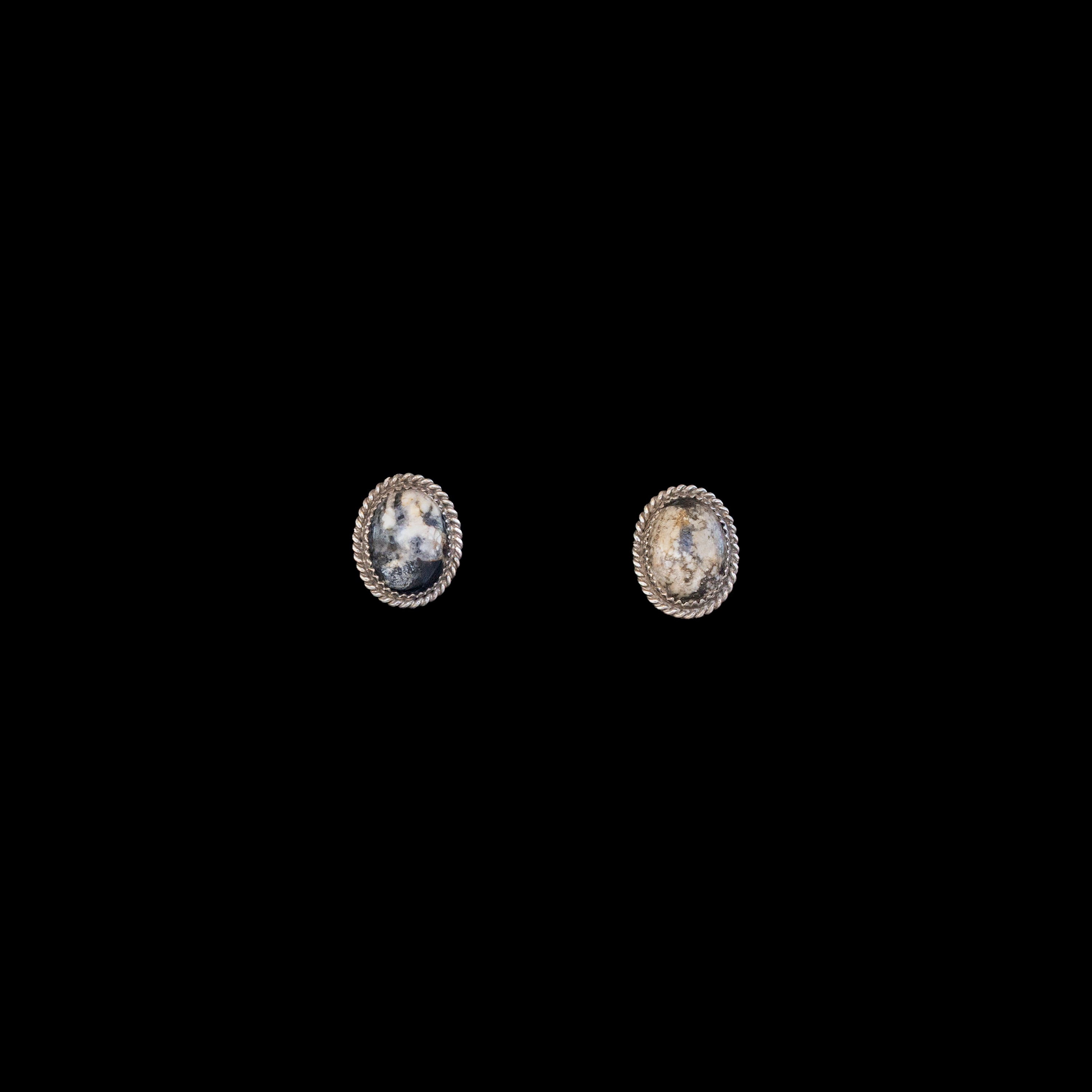 White buffalo earrings set in silver